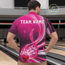 Load image into Gallery viewer, Front view of a male model in a pink bowling quarter zip featuring breast cancer awareness ribbon artwork and bowling graphics