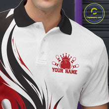 Load image into Gallery viewer, Close-up view of the left chest of a white, black, and red bowling polo shirt featuring a flaming bowling ball hitting the pins artwork.