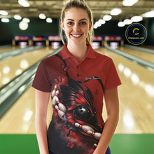 Load image into Gallery viewer, Female model wearing a red and black bowling polo shirt at a bowling lane with butterfly artwork, bowling ball graphics, and pins.
