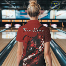 Load image into Gallery viewer, Back view of a female model in a bowling venue wearing a red and black polo shirt featuring a butterfly wrapped around a bowling ball.