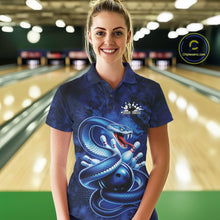 Load image into Gallery viewer, Female model wearing a bowling polo at the bowling lane with blue cobra artwork and scattered bowling pins.