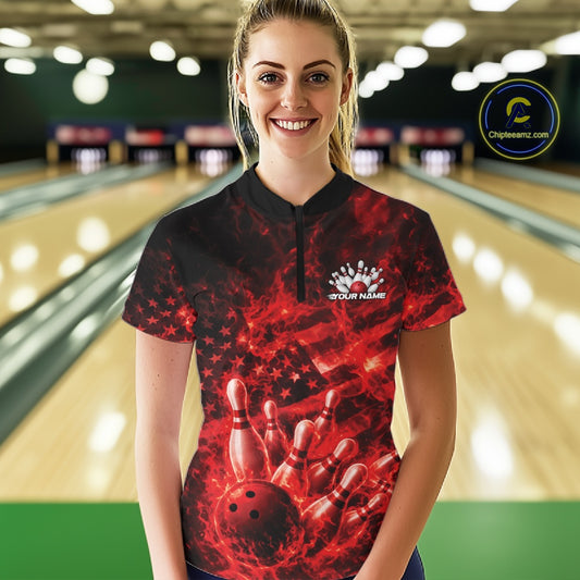 Female model wearing a black and red bowling quarter-zip in a bowling alley with fiery bowling graphics and patriotic background details.