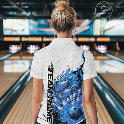 Back view female model in bowling lane wearing white and blue quarter zip featuring flaming bowling ball crashing into pins with dynamic fiery bowling graphics.