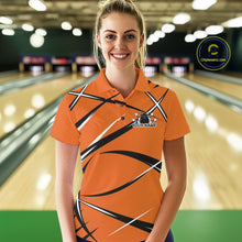 Load image into Gallery viewer, Front view of a female bowler wearing an orange, black, and white bowling polo shirt in a bowling lane