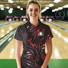 Load image into Gallery viewer, Female model wearing a black and red bowling polo shirt at a bowling lane with fiery bowling strike artwork and patriotic accents.