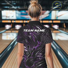 Load image into Gallery viewer, Back view of a female model in a bowling venue wearing a black and purple polo shirt featuring a fiery bowling action scene and flag-inspired graphics.
