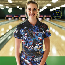 Load image into Gallery viewer, Female model front view at the bowling lane wearing a bowling polo shirt with flaming eagle graphics, blue bowling ball, American flag, and blue flames.