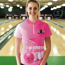 Load image into Gallery viewer, Female model front view in a bowling lane wearing a quarter zip shirt with bowling ball and pins arranged within a pink gradient layout.