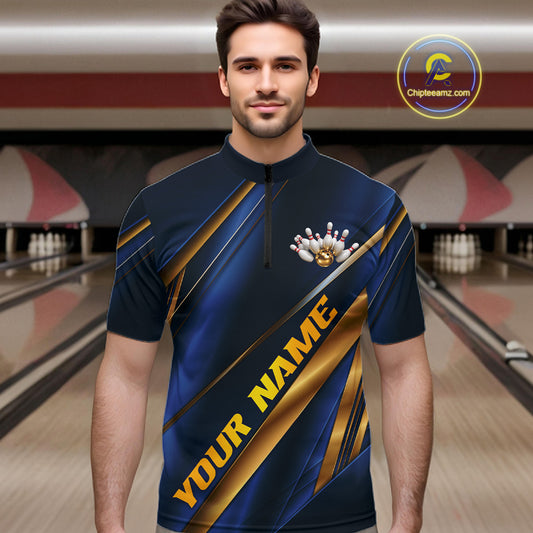 A man wearing a custom bowling shirt with a blue and gold graphic design, set against a blurred bowling alley background. The shirt features diagonal gold stripes, a bowling pin graphic, and the text 'YOUR NAME'.