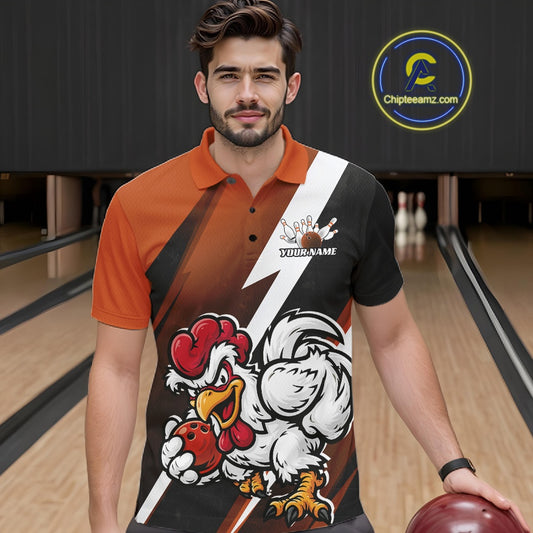 A man in a bowling alley wearing a custom-designed short-sleeve polo shirt with a bold graphic of a cartoon rooster and white text that reads 'YOUR NAME'. The shirt features a color-blocked design of orange, black, brown, and white.