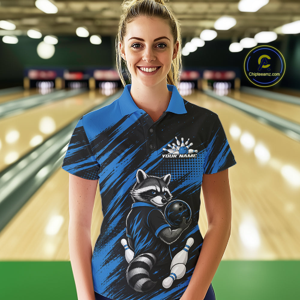 A woman stands in a bowling alley wearing a custom blue and black short-sleeve bowling polo shirt with a raccoon graphic and 'YOUR NAME' printed on the chest. A circular 'Chipeamz.