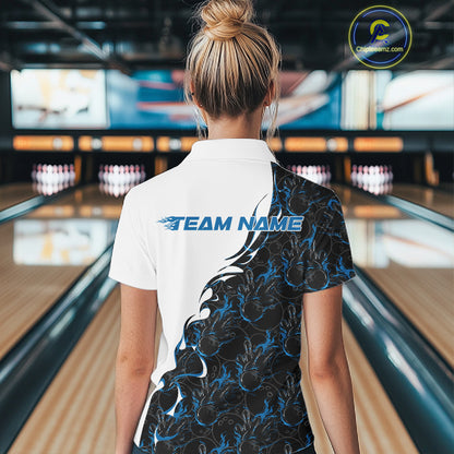 Back view of a female model in a bowling lane wearing a white quarter-zip shirt featuring blue and black flame bowling pattern with sporty athletic graphics.