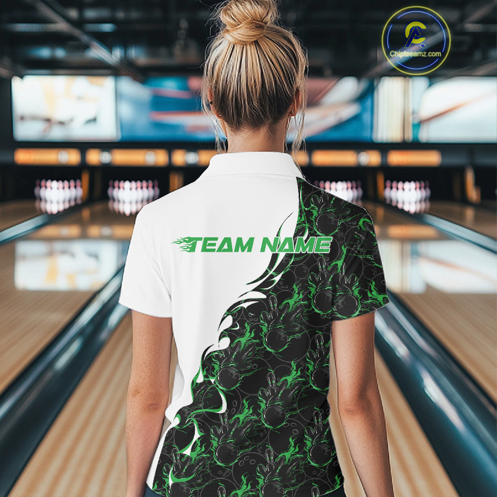 Back view of a female model in a bowling lane wearing a white quarter-zip shirt, showcasing green and black flame bowling pattern with bold athletic bowling graphics.