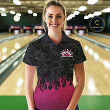 Load image into Gallery viewer, Front view of a female model in a bowling lane wearing a black polo shirt with vibrant pink flames and bowling ball pattern and energetic bowling action visuals.