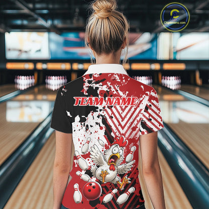 A woman viewed from behind wearing a short-sleeve bowling-themed graphic shirt in a bowling alley. The shirt features a split black and red design with white splatter, a cartoon chicken, bowling pins, and the text 'TEAM NAME' across the upper back.