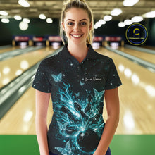 Load image into Gallery viewer, Female model wearing a black and turquoise blue bowling polo shirt at the lane with cosmic flaming strike artwork and glowing butterflies.