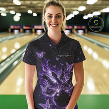 Load image into Gallery viewer, Female model in a black and purple bowling polo shirt at the lane with cosmic flaming strike artwork.