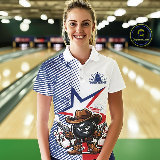 A woman stands in a bowling alley wearing a custom printed polo shirt. The shirt features a split design with blue diagonal stripes on the left, a white right side with a blue star and 'YOUR NAME' text, and a cartoon black ball character in a cowboy hat holding bowling pins on the front.