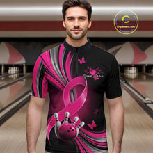 Load image into Gallery viewer, Male model wearing a black and pink bowling quarter zip with breast cancer awareness ribbons, small butterflies, and bowling graphics, front view