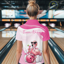 Load image into Gallery viewer, Back view of a female model in a bowling center wearing a pink polo shirt showcasing a stylish flamingo beside a bowling ball.