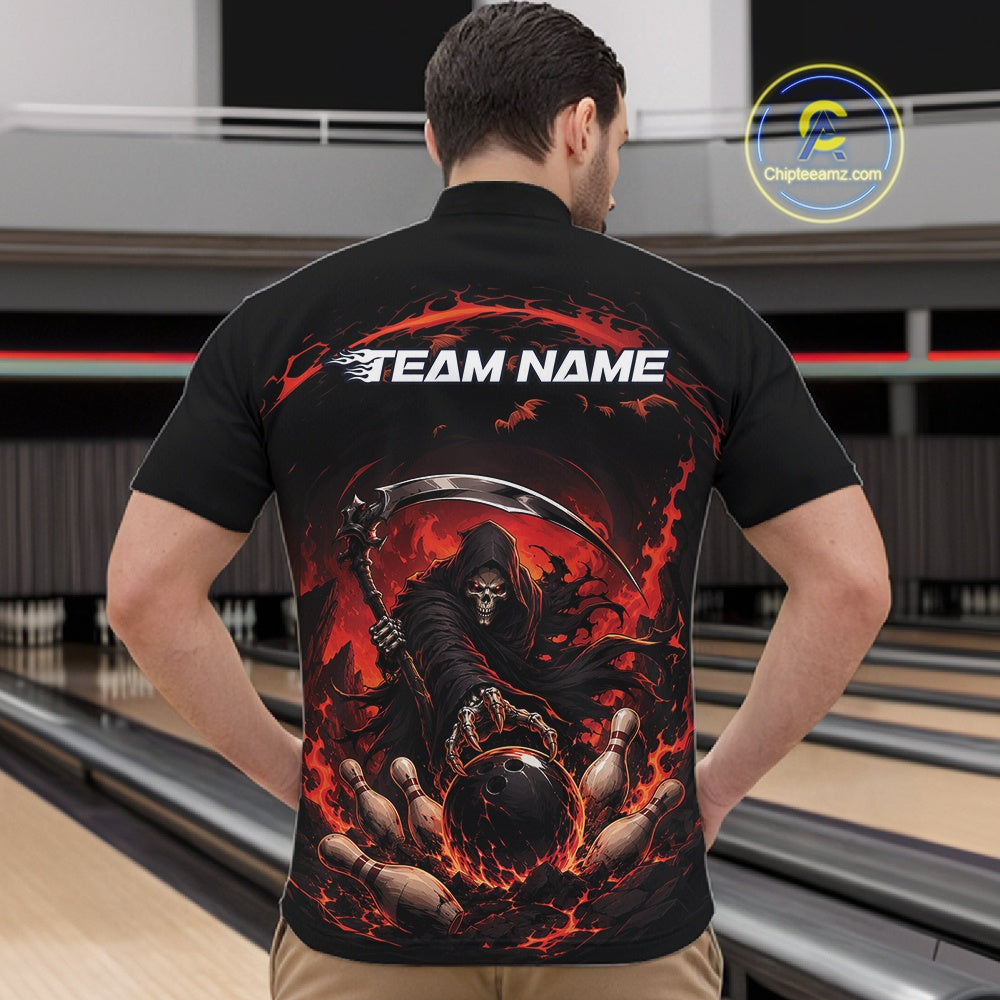 Male model shown from the front wearing a black and red bowling quarter zip shirt with a grim reaper reaching through swirling flames to command a blazing bowling ball striking scattered pins in a bowling lane.