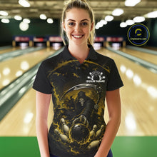 Load image into Gallery viewer, Front view of a female model wearing a black and yellow bowling polo shirt featuring a grim reaper commanding a blazing bowling ball crashing into scattered pins through swirling flames in a bowling lane.