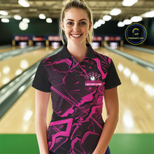 Load image into Gallery viewer, Female model wearing a black and pink bowling polo in a bowling center with futuristic cracked graphics.