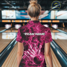 Load image into Gallery viewer, Back view of a womens bowling polo displaying a pink bowling ball hitting pins with dramatic flame accents.