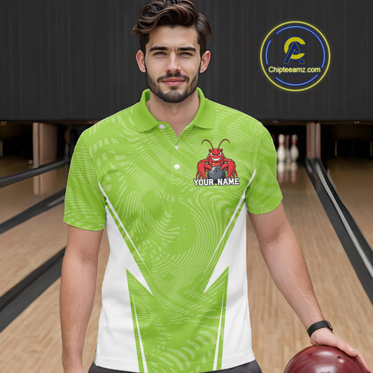 Front view of a male model in a bowling alley wearing a light green custom bowling polo shirt with a funny aggressive crawfish holding a bowling ball in a sporty design style.