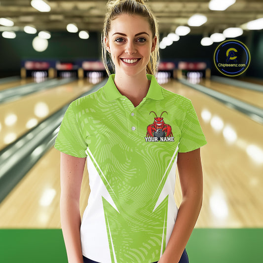 Front view of a female model in a bowling alley wearing a light green custom bowling polo shirt with a funny aggressive crawfish holding a bowling ball in a sportswear-style design.