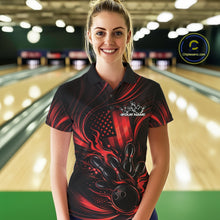 Load image into Gallery viewer, Female model at a bowling lane wearing a black and red bowling polo shirt with patriotic bowling action graphics and bold flame details.