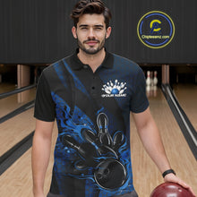 Load image into Gallery viewer, Male model at a bowling lane wearing a black and blue bowling polo shirt with fiery bowling artwork and geometric stripe accents.