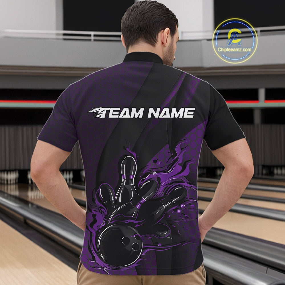 Male model at a bowling lane wearing a black and purple bowling quarter-zip shirt with a flaming bowling ball striking pins, hexagon graphics, and diagonal stripe accents.