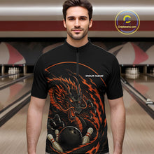 Load image into Gallery viewer, Front view of a male model in a bowling alley wearing an orange custom quarter-zip bowling shirt featuring an aggressive dragon with flames in a dynamic and energetic design.
