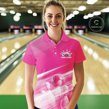 Load image into Gallery viewer, Front view female model in a bowling lane wearing a pink bowling polo shirt with bowling ball and pins blended into a geometric pattern.