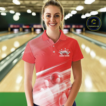 Load image into Gallery viewer, Front view female model at the bowling lane wearing a red bowling polo shirt with bowling ball and pins geometric artwork.