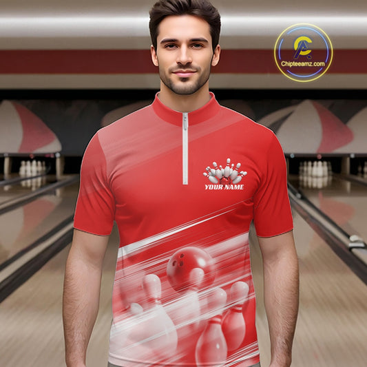 Male model front view in a bowling lane wearing a red bowling quarter zip shirt with bowling ball and pins geometric pattern.