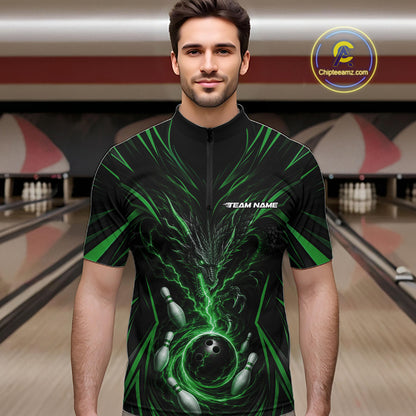 A man wearing a black short-sleeve zip-front jersey with a green and gray bowling-themed graphic print, standing in a bowling alley. The jersey has a white 'TEAM NAME' placeholder on the chest