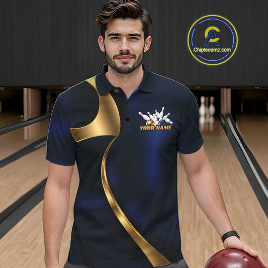 A man wearing a custom bowling shirt in a bowling alley. The shirt is navy blue with a gold diagonal stripe, a white bowling pins graphic, and 'YOUR NAME' printed in gold on the chest.