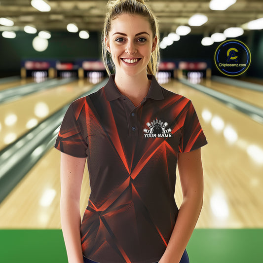 Woman wearing a custom orange  bowling shirt with a logo and text in a bowling alley.