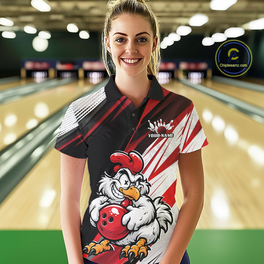 A woman wearing a custom bowling shirt with a cartoon chicken graphic, standing in a bowling alley. The shirt features a black, white, and red design with a red bowling ball and chicken mascot.