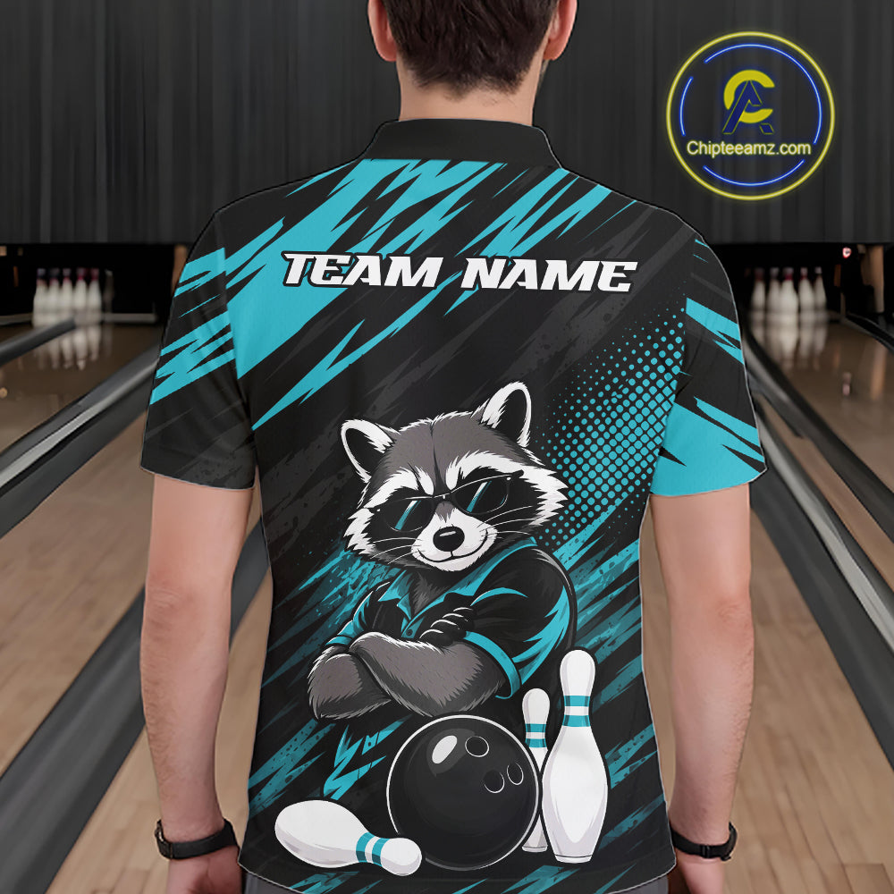 A person viewed from behind wearing a short-sleeve bowling-themed shirt with a raccoon graphic, bowling pins, and teal and black diagonal brushstroke patterns. The shirt has 'TEAM NAME' printed across the upper back.