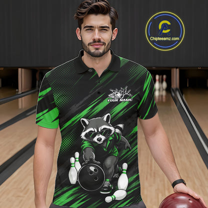A man wearing a custom bowling-themed polo shirt with a raccoon graphic, standing in a bowling alley. The shirt features a black and green pattern with a cartoon raccoon holding a bowling ball and pins.