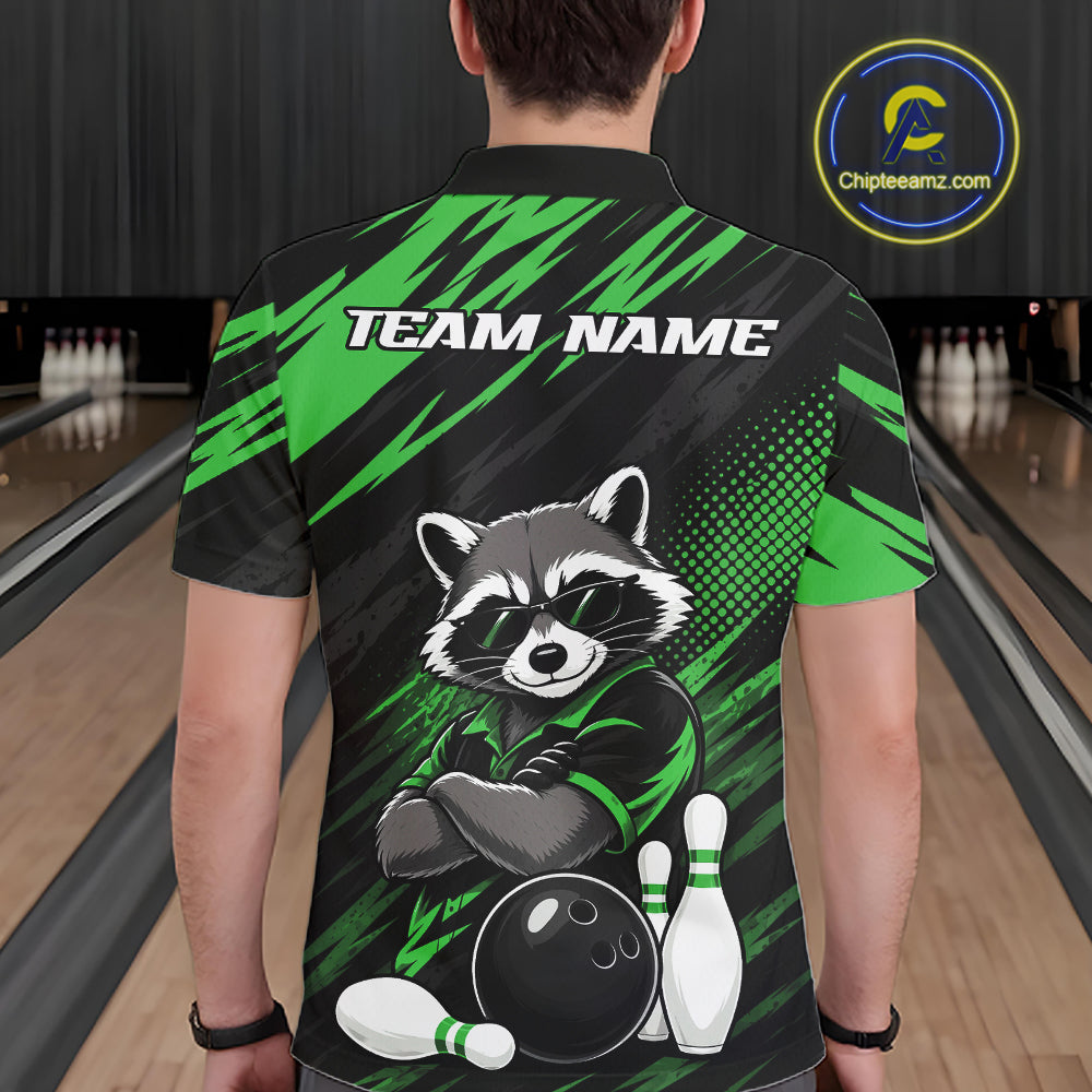 A person viewed from behind wearing a short-sleeve bowling shirt with a raccoon graphic and the words 'TEAM NAME' on the back. The shirt has a black and bright green design with bowling pins and a bowling ball illustration.
