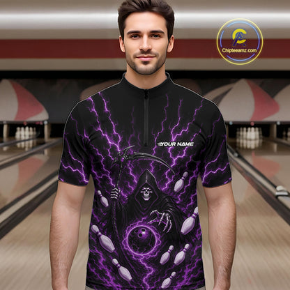 A man wearing a black short-sleeve quarter zip shirt bowling jersey with a purple lightning and grim reaper graphic, standing in front of a blurred bowling alley background. 