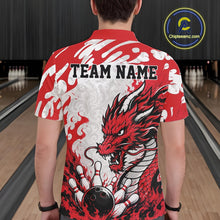 Load image into Gallery viewer, Person wearing a red and white bowling shirt with a dragon design and 'TEAM NAME' text in a bowling alley.