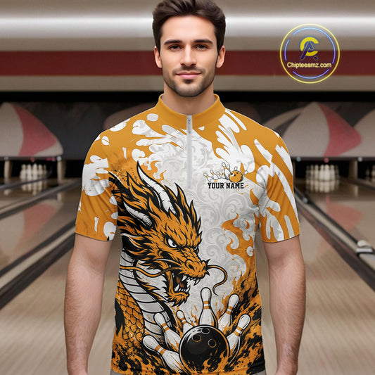 Man wearing a bowling shirt with a dragon design in a bowling alley.