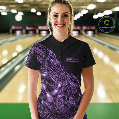 Female model wearing a black and purple bowling quarter-zip shirt at the bowling lane with tribal flame bowling accents.