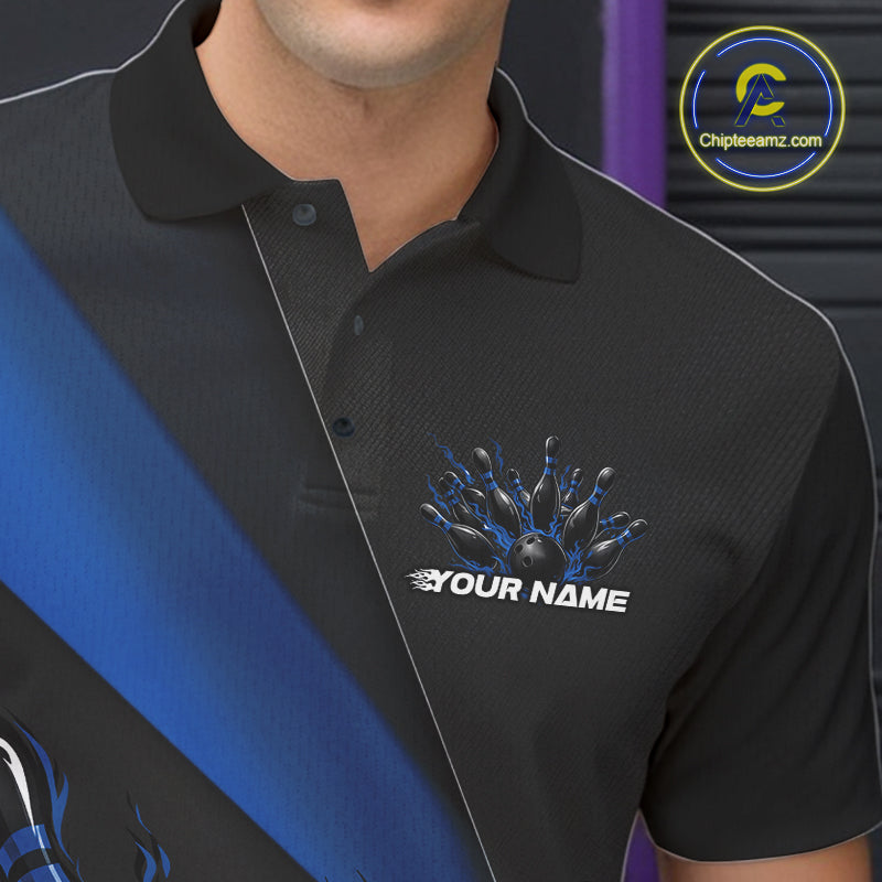 Close-up view of the left chest area of a black and blue bowling polo shirt featuring a flame bowling ball and pins design detail.