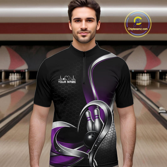 Male model in a bowling lane wearing a black and purple quarter zip shirt with honeycomb texture and a heart-framed bowling ball and pins graphic.